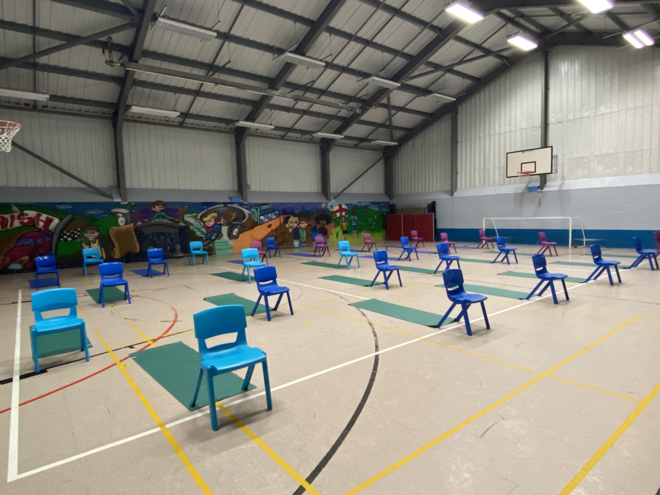 Sports Hall at Friar Park Millennium Centre set out with chairs and yoga mats
