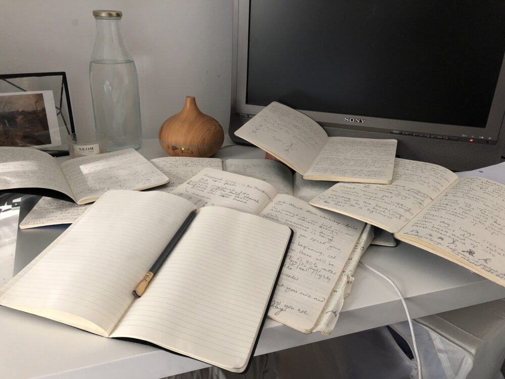 Bryony Morris's desk showing yoga books and notepads